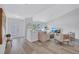 Bright and airy living room with hardwood floors, vaulted ceiling, and comfortable seating for relaxing and entertaining at 3725 Spyglass Hill Rd, Sarasota, FL 34238