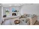 Inviting living room with vaulted ceilings, fireplace and an abundance of natural light at 3725 Spyglass Hill Rd, Sarasota, FL 34238