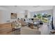 Spacious living room filled with light and featuring an oversized sectional and large windows for comfortable living at 3725 Spyglass Hill Rd, Sarasota, FL 34238