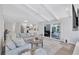 Bright and cozy living room connected to the kitchen with sliding door access to the lanai at 3725 Spyglass Hill Rd, Sarasota, FL 34238