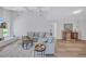 Bright, open living room with a cozy seating area, hardwood floors, and ample natural light at 3725 Spyglass Hill Rd, Sarasota, FL 34238