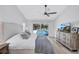 Bedroom with view of screened pool, light grey textiles and decorative dresser at 3725 Spyglass Hill Rd, Sarasota, FL 34238
