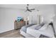 The relaxing main bedroom features calming colors, a ceiling fan, and a decorative dresser at 3725 Spyglass Hill Rd, Sarasota, FL 34238