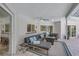 Covered patio with comfortable seating, ceiling fan and stylish outdoor rug at 3725 Spyglass Hill Rd, Sarasota, FL 34238