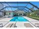 Enjoy the sparkling screened pool with ample lounge space perfect for outdoor entertaining and relaxation at 3725 Spyglass Hill Rd, Sarasota, FL 34238