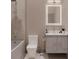 Modern bathroom featuring sleek vanity, illuminated mirror, and shower with rainfall head at 3811 30Th S Ave, St Petersburg, FL 33711