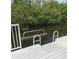 Dock stairs descend into tranquil water, complemented by lush greenery in this waterside property at 3811 30Th S Ave, St Petersburg, FL 33711