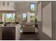 Bright living room with tall ceilings, neutral tones, and large windows offering a view of the outdoors at 3811 30Th S Ave, St Petersburg, FL 33711