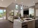 Open-concept living and kitchen area featuring a marble island, neutral decor, and ample natural light at 3811 30Th S Ave, St Petersburg, FL 33711