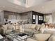 Open-concept living space with a modern kitchen, dining area, and a comfortable seating area with a glass coffee table at 3811 30Th S Ave, St Petersburg, FL 33711