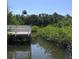 Scenic water view showcasing serene water surrounded by lush greenery and clear blue skies at 3811 30Th S Ave, St Petersburg, FL 33711