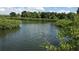 Picturesque water view showcasing serene water surrounded by lush greenery and clear blue skies at 3811 30Th S Ave, St Petersburg, FL 33711