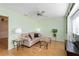 Comfortable living room with hardwood floors, ceiling fan, and plenty of natural light at 3917 Ashwood Ln # 57, Sarasota, FL 34232