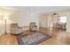 Open living room with hardwood floors connecting dining area in home at 3917 Ashwood Ln # 57, Sarasota, FL 34232