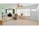 Cozy sun room with large windows, lots of sunlight, and neutral carpeting at 3917 Ashwood Ln # 57, Sarasota, FL 34232