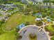 Aerial view of a community soccer field, tennis court, playground and neighborhood pool at 4021 Wildgrass Pl, Parrish, FL 34219