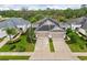 Aerial view of a one-story home with well-maintained landscaping and a two car garage at 4021 Wildgrass Pl, Parrish, FL 34219