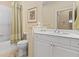 Bathroom featuring a white vanity, bathtub with shower, and neutral décor at 4021 Wildgrass Pl, Parrish, FL 34219
