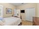 Comfortable bedroom with hardwood floors and closet at 4021 Wildgrass Pl, Parrish, FL 34219