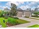 Charming single-story home featuring a manicured lawn, mature landscaping and a two car garage at 4021 Wildgrass Pl, Parrish, FL 34219