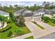 A home with a lush green lawn and well-manicured landscaping, a two-car garage, and a welcoming entrance at 4021 Wildgrass Pl, Parrish, FL 34219