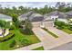 A home with a lush green lawn and well-manicured landscaping, a two-car garage, and a welcoming entrance at 4021 Wildgrass Pl, Parrish, FL 34219