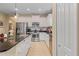 Well-equipped kitchen featuring stainless steel appliances, white cabinetry, and granite countertops at 4021 Wildgrass Pl, Parrish, FL 34219