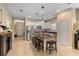 Spacious kitchen with stainless appliances, bar seating, and granite countertops at 4021 Wildgrass Pl, Parrish, FL 34219