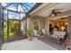 Relaxing screened-in lanai with comfortable seating, perfect for enjoying outdoor living at 4021 Wildgrass Pl, Parrish, FL 34219