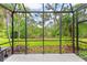 Spacious screened lanai showcases beautiful views of the landscaped backyard at 4021 Wildgrass Pl, Parrish, FL 34219