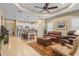 Open-concept living space showcases the kitchen, living room and a view to screened lanai at 4021 Wildgrass Pl, Parrish, FL 34219