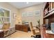 Home office space with built-in wooden shelving, a desk, and natural light at 4021 Wildgrass Pl, Parrish, FL 34219