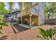 Charming home featuring a deck, covered patio, and a screened-in pool in the backyard at 4063 Woodview Dr, Sarasota, FL 34232