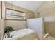 Tiled bathroom with a soaking tub and walk-in shower at 4063 Woodview Dr, Sarasota, FL 34232