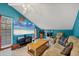 Cozy bonus room with vaulted ceiling, a large TV, and comfortable seating at 4063 Woodview Dr, Sarasota, FL 34232