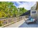 Relaxing deck area with lounge chairs and green foliage at 4063 Woodview Dr, Sarasota, FL 34232