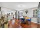 Bright dining area adjacent to the kitchen, featuring hardwood floors and ample natural light at 4063 Woodview Dr, Sarasota, FL 34232