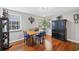 Inviting dining room with hardwood floors, natural light, and a classic table set, ideal for Gathering meals at 4063 Woodview Dr, Sarasota, FL 34232