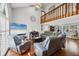 Spacious living room with high ceilings, hardwood floors, and a loft area, offering a comfortable and stylish living space at 4063 Woodview Dr, Sarasota, FL 34232
