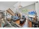 Spacious living room featuring high ceilings, hardwood floors and lots of natural light at 4063 Woodview Dr, Sarasota, FL 34232
