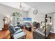Bright living room with high ceilings, large windows, hardwood floors and comfortable seating at 4063 Woodview Dr, Sarasota, FL 34232