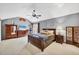 Spacious bedroom featuring high ceilings, natural light, and warm decor at 4063 Woodview Dr, Sarasota, FL 34232