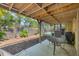 Cozy covered patio with seating area, perfect for outdoor entertaining at 4063 Woodview Dr, Sarasota, FL 34232