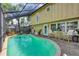 Backyard pool with screened enclosure and a ducky! at 4063 Woodview Dr, Sarasota, FL 34232