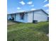 Clean and well-maintained house featuring a grassy front lawn at 4070 Grobe St, North Port, FL 34287