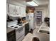 Bright kitchen featuring white appliances and ample cabinet space at 4070 Grobe St, North Port, FL 34287
