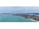 Gorgeous aerial shot showcasing a waterfront property surrounded by lush greenery at 4214 Higel Ave, Sarasota, FL 34242