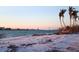 Scenic beach view featuring calm turquoise water and serene sandy shoreline at sunset at 4214 Higel Ave, Sarasota, FL 34242