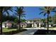 Elegant home exterior with well-maintained gardens, a charming guesthouse, and a spacious layout at 4214 Higel Ave, Sarasota, FL 34242