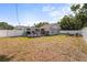 Expansive backyard featuring a deck, seating area, and well-maintained lawn, perfect for outdoor entertaining at 4311 2Nd E Ave, Bradenton, FL 34208